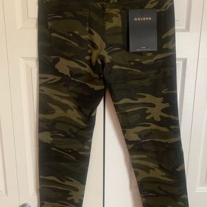 Selling a pair of camo golden denim pants.